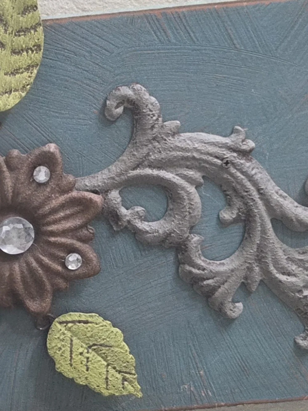 Vintage teal rustic coat hooks with movable flower petals
